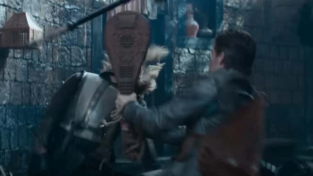 Edgin the bard slams his lute into a city guardsman's face.