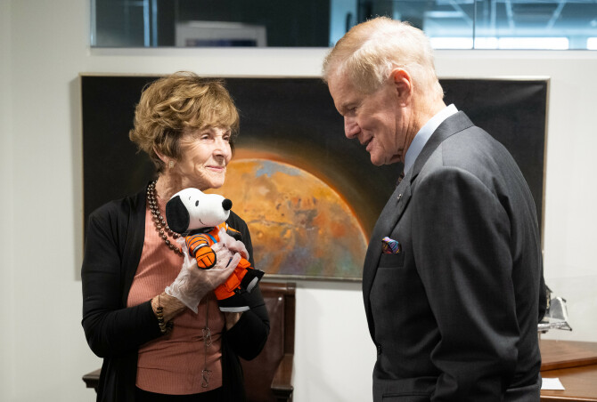 NASA administrator Bill Nelson and Jeannie Schulz with the Snoopy doll that flew on Artemis I