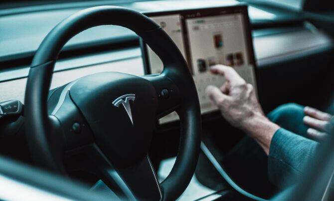 A Tesla steering wheel and infotainment system.