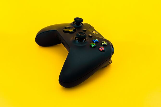 Xbox controller against a yellow background.
